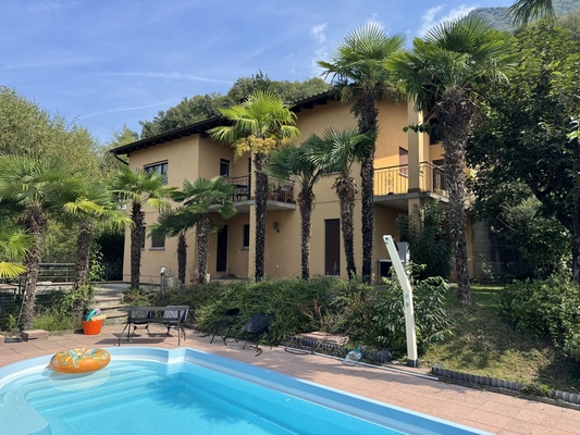 Pregassona Alta – Elegante 3.5-Zimmer-Wohnung mit privatem Garten und Pool